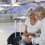 Senior,Couple,Traveling,Airport,Scene