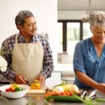 Food,,Elderly,Couple,And,Cooking,While,Happy,In,Kitchen,Of
